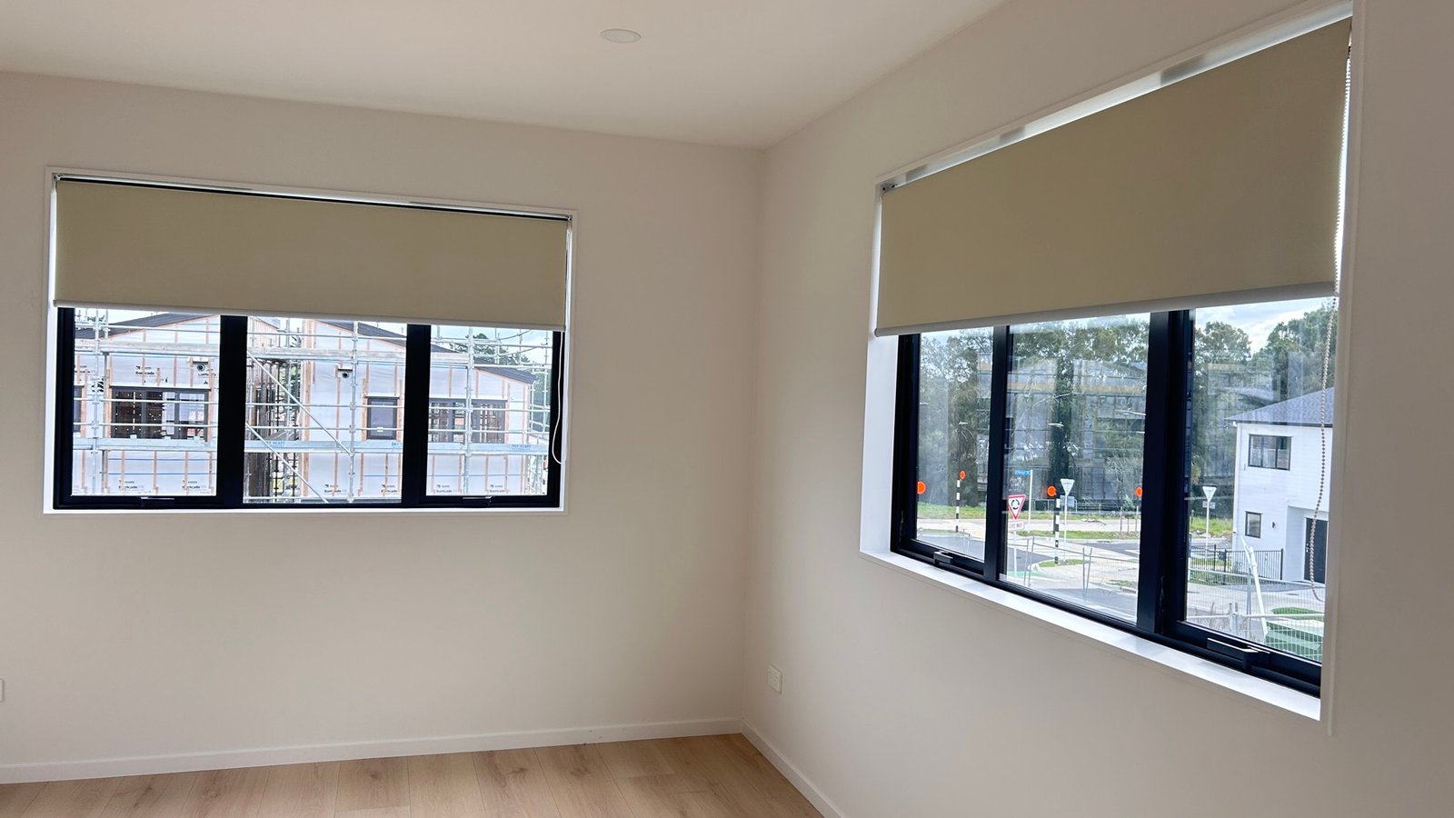 Roller blinds in a bright Auckland bedroom