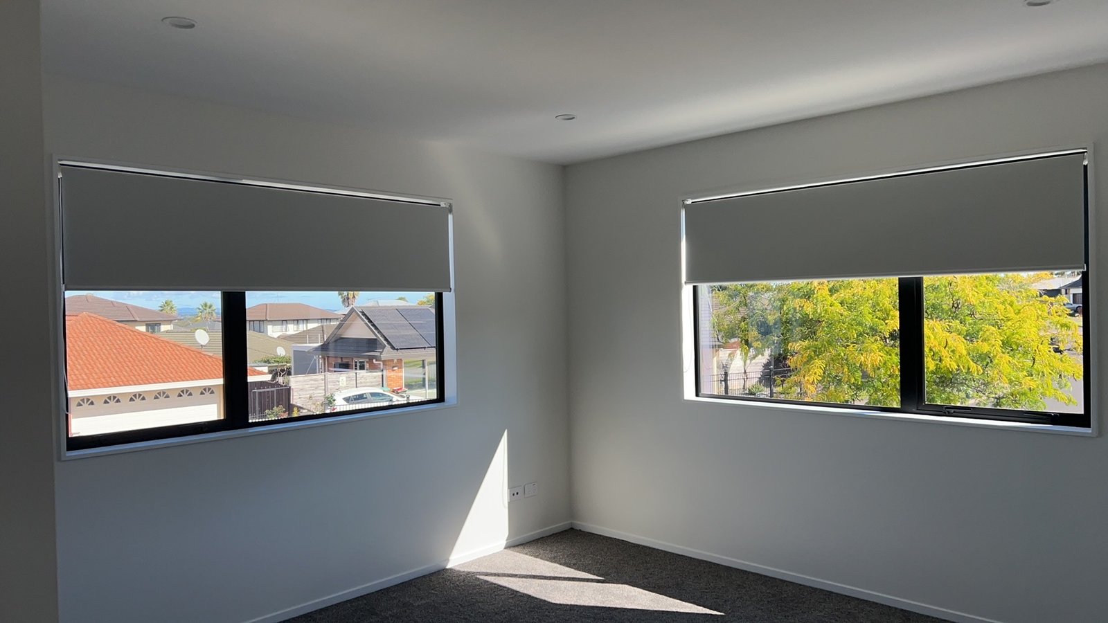 Roller blinds in a sunny bedroom