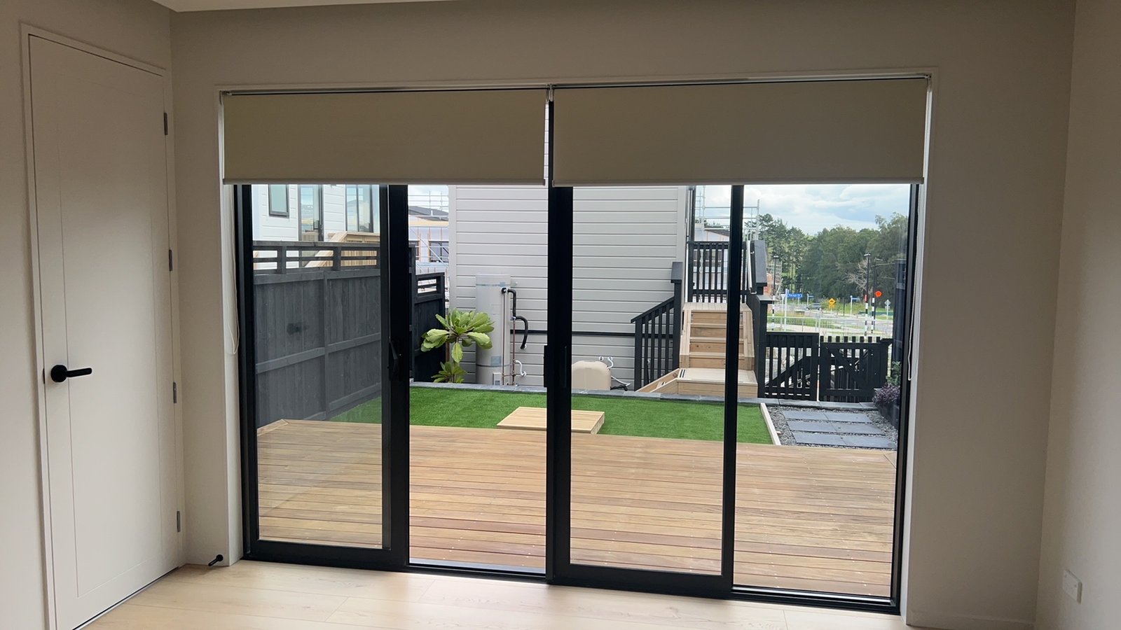 Roller blinds on sliding doors with deck view