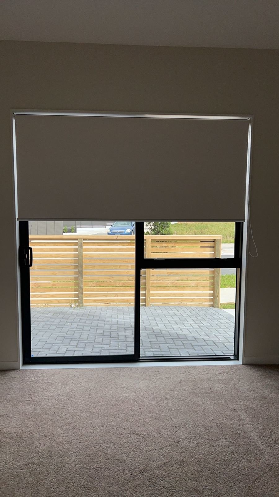 Blockout roller blind on a sliding door
