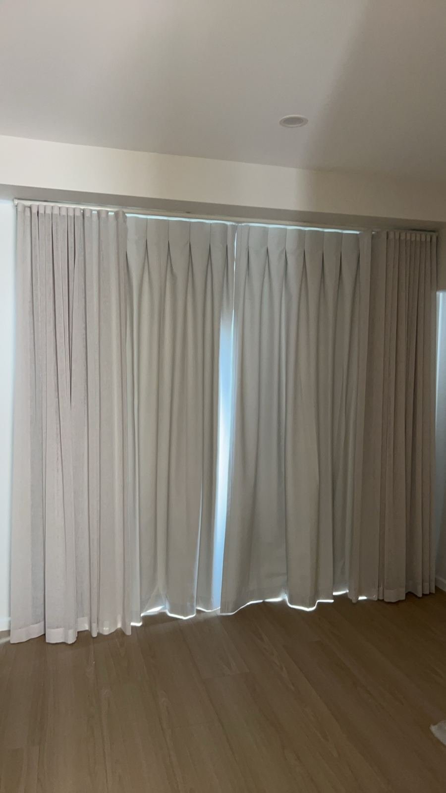 Wave-fold fabric curtains with sheer layer